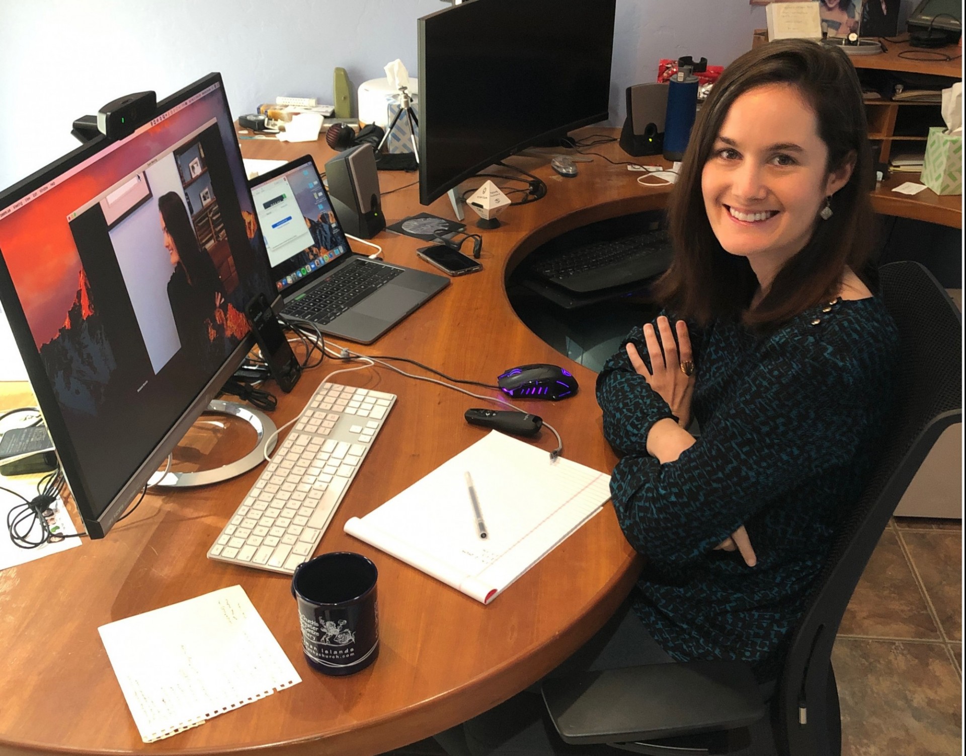 Photo of Melanie Brucks sitting at her desk