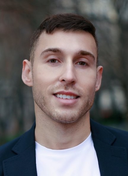 Head shot of Jon Freeman wearing a suit jacket and white shirt