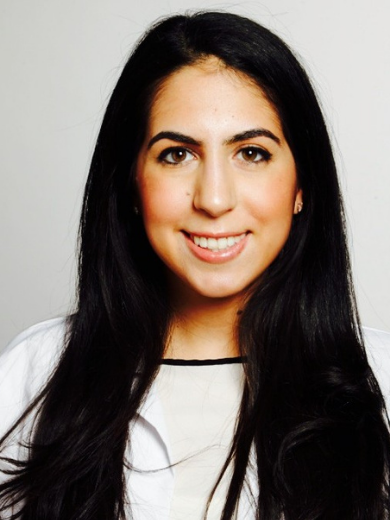 Headshot of Daniela Elazari with long dark straight hair wearing a white shirt