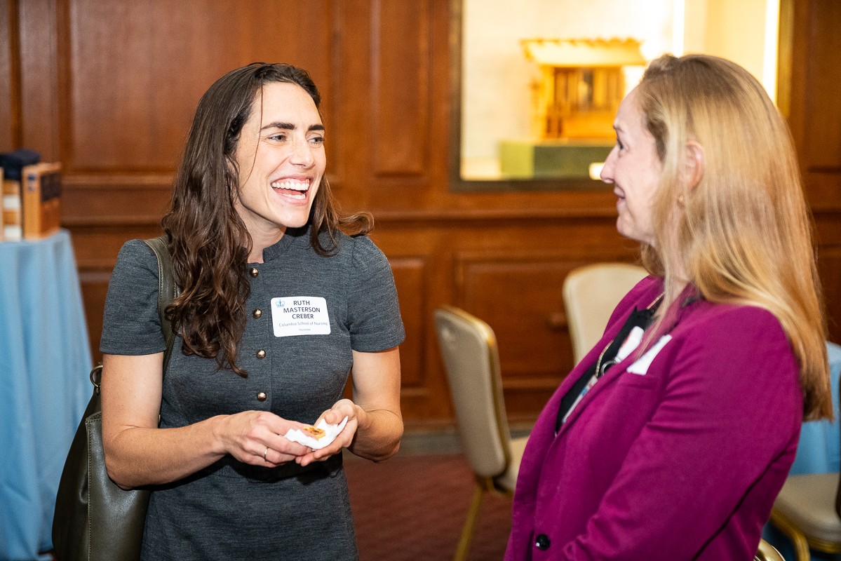 Left to Right: Ruth Masterson Creber, Professor of Nursing, who was just awarded tenure, and Sarah Rosetti, Associate Professor of Biomedical Informatics and Nursing. Woman laughing speaking to woman smiling