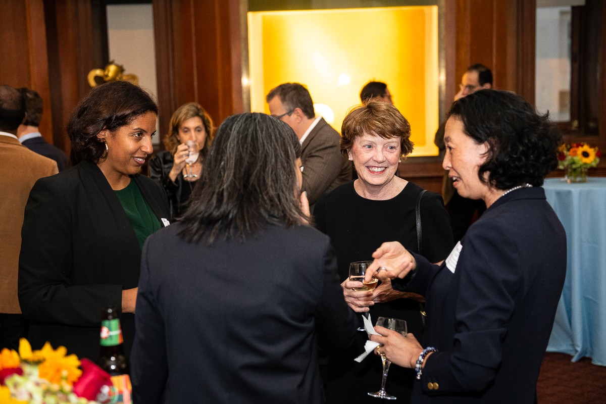 From left to right: Adina Brooks, Associate Provost for Faculty Advancement, Eugenia Lean, Vice Provost for Faculty Affairs and Professor of East Asian Languages and Cultures, Mary Boyce, Provost and Professor of Mechanical Engineering, and Helen Lu, Percy K. and Vida L.W. Hudson Professor of Biomedical Engineering and Professor of Dental and Craniofacial Engineering (in Dental Medicine); Senior Vice Dean of Faculty Affairs and Advancement. four women speaking and smiling at a cocktail reception.