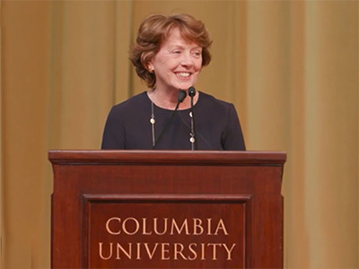 Provost Mary C. Boyce delivers remarks at the 2023 Celebration of Teaching and Learning Symposium. Provost Boyce speaks frequently about the importance of innovation through interdisciplinary collaboration, a key priority throughout her ten years of leadership at Columbia. Provost Mary Boyce at a podium smiling.