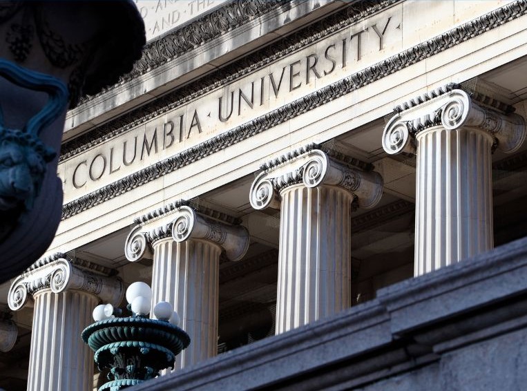 Marble facade of romanesque building with Columbia University engraved
