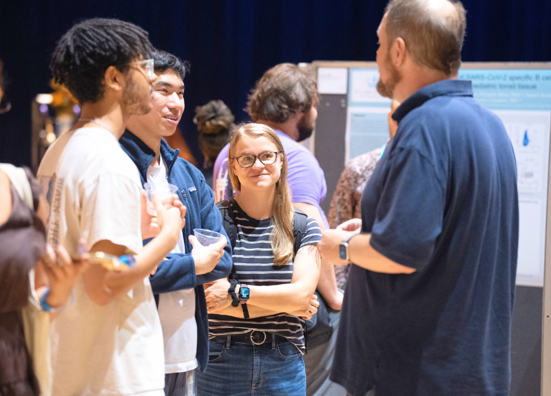 Students, Admissions Officers, and Staff attending the 2024 CUPP Symposium and Mini Admissions Fair Student presenting research