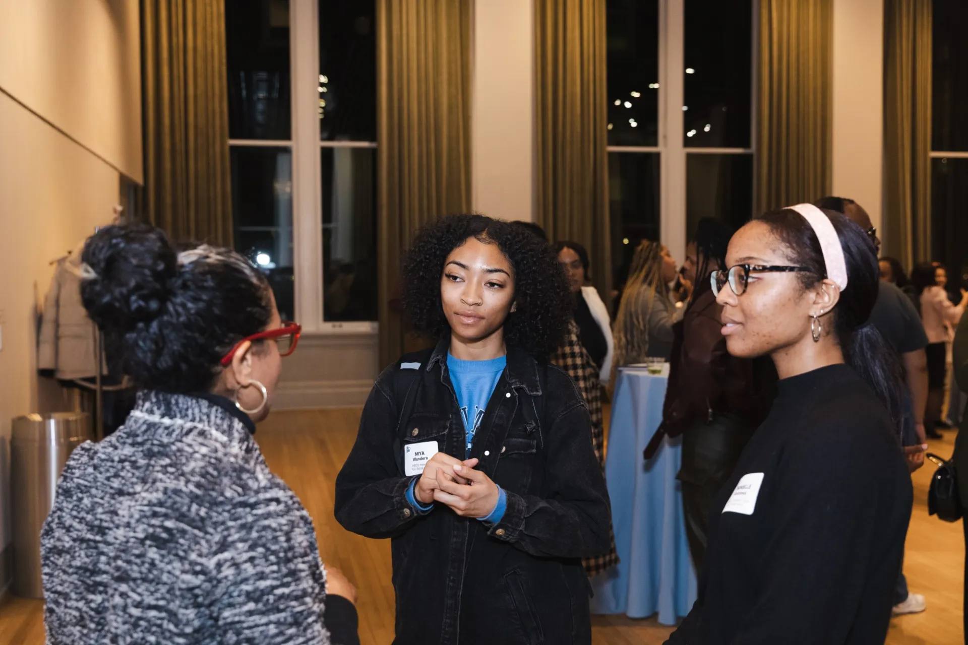 Students and speaker Brittany Fox-Williams speaking at the HB/CU Connections reception