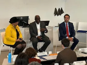 three panelists seated 