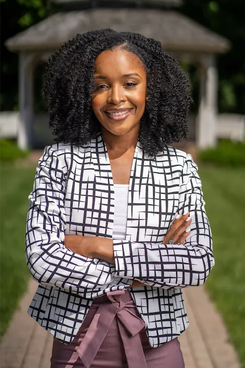Head shot of Natasha Johnson with arms folded