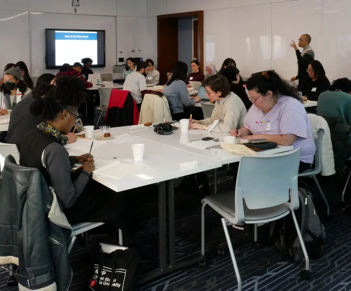 students sitting at desks writing