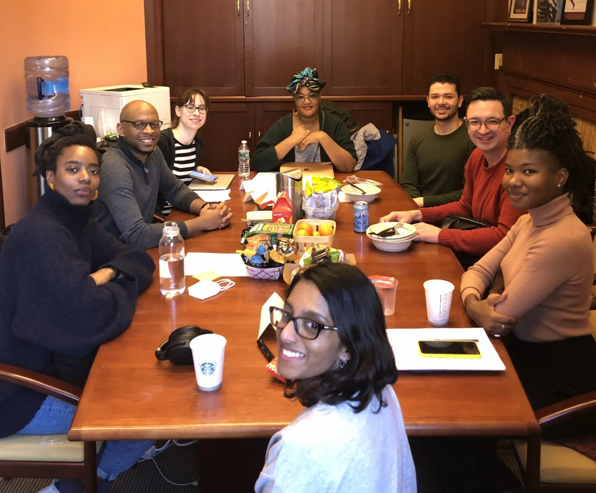 students sitting around a conference table 