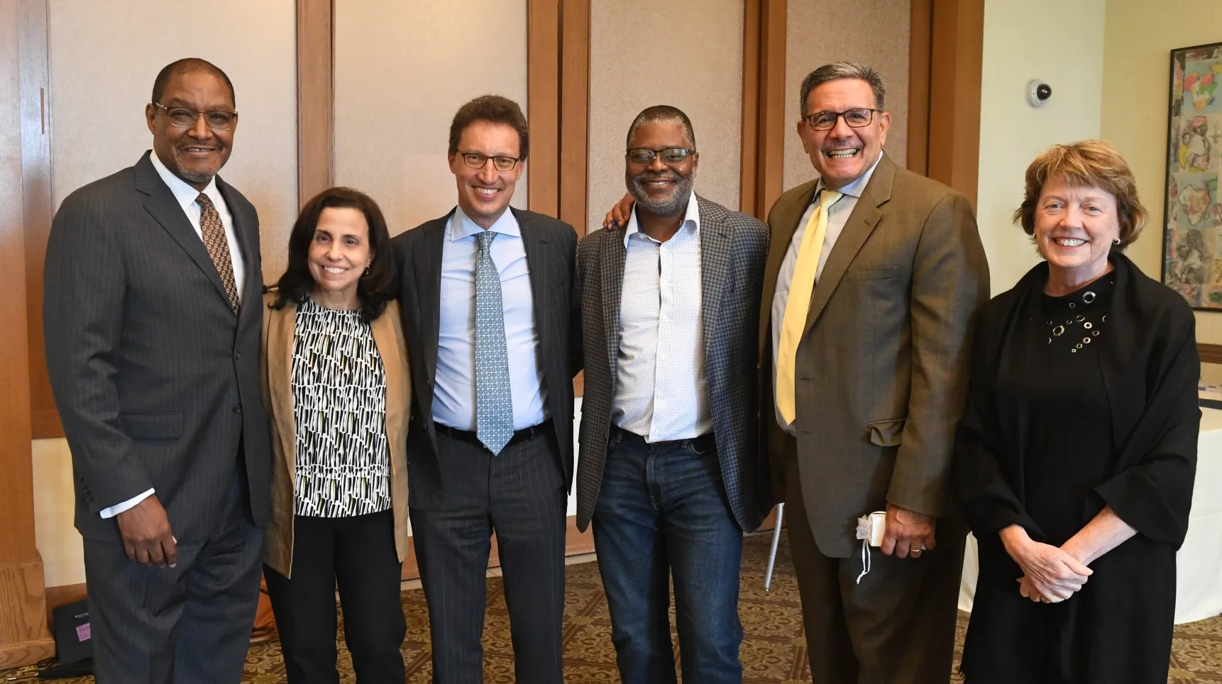 Dennis Mitchell, Trustees Kathy Surace Smith, Keith Goggin, Duchesne Drew, Rolando Acosta, and Provost Mary Boyce