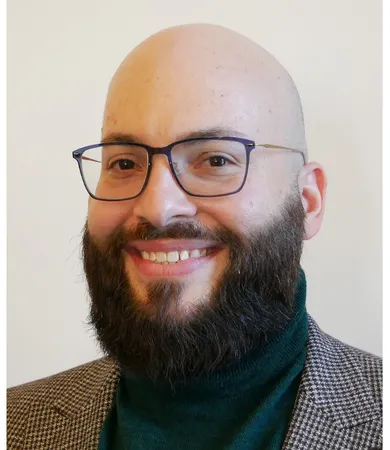 Head shot of Dror Levy wearing glasses and smiling