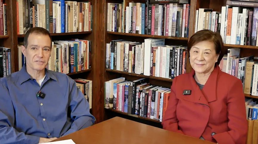 Karl Jacoby and Mae Ngai seated in front of a bookcase