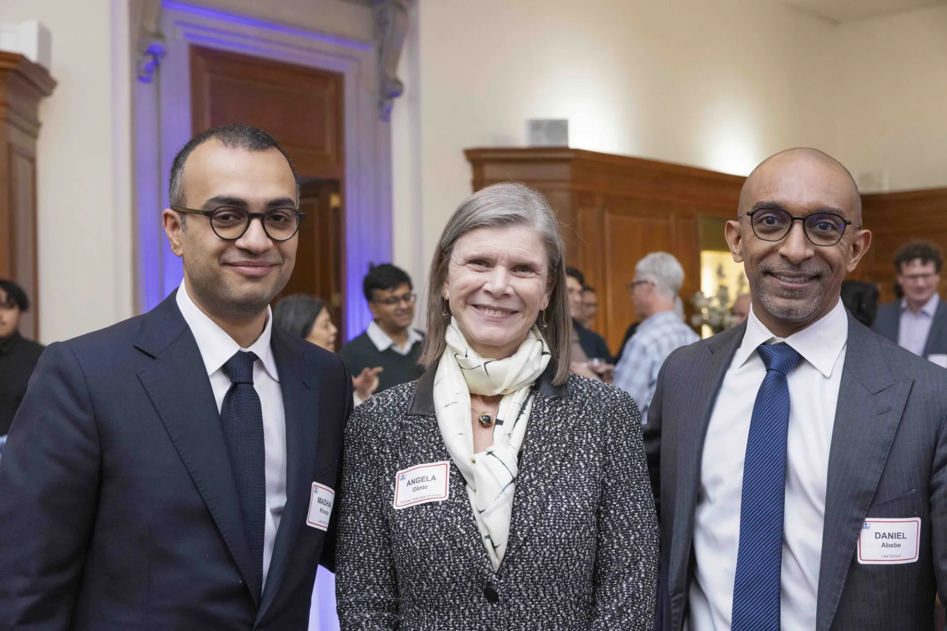 Three people pose for a photo.