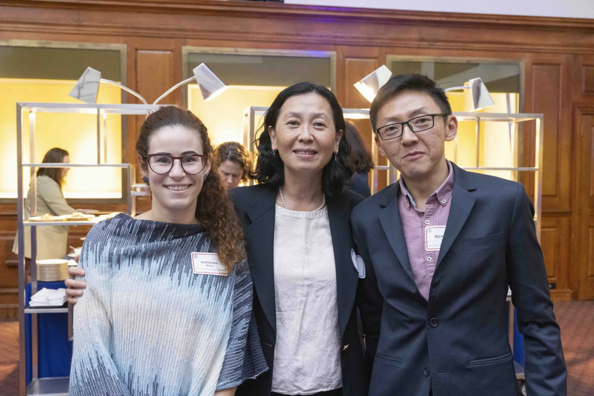 Three people pose for a photo. 
