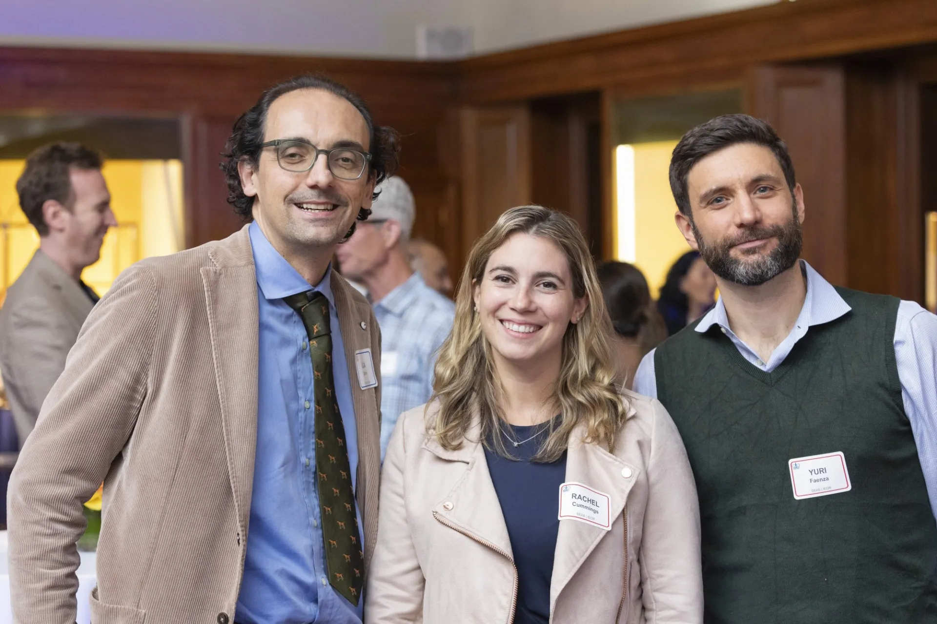 Three people pose for a photo.