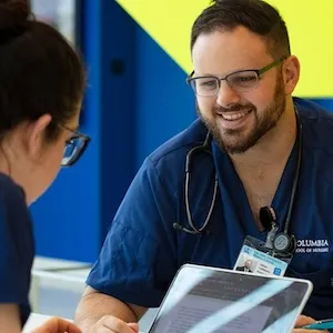 Two nursing students working together. 