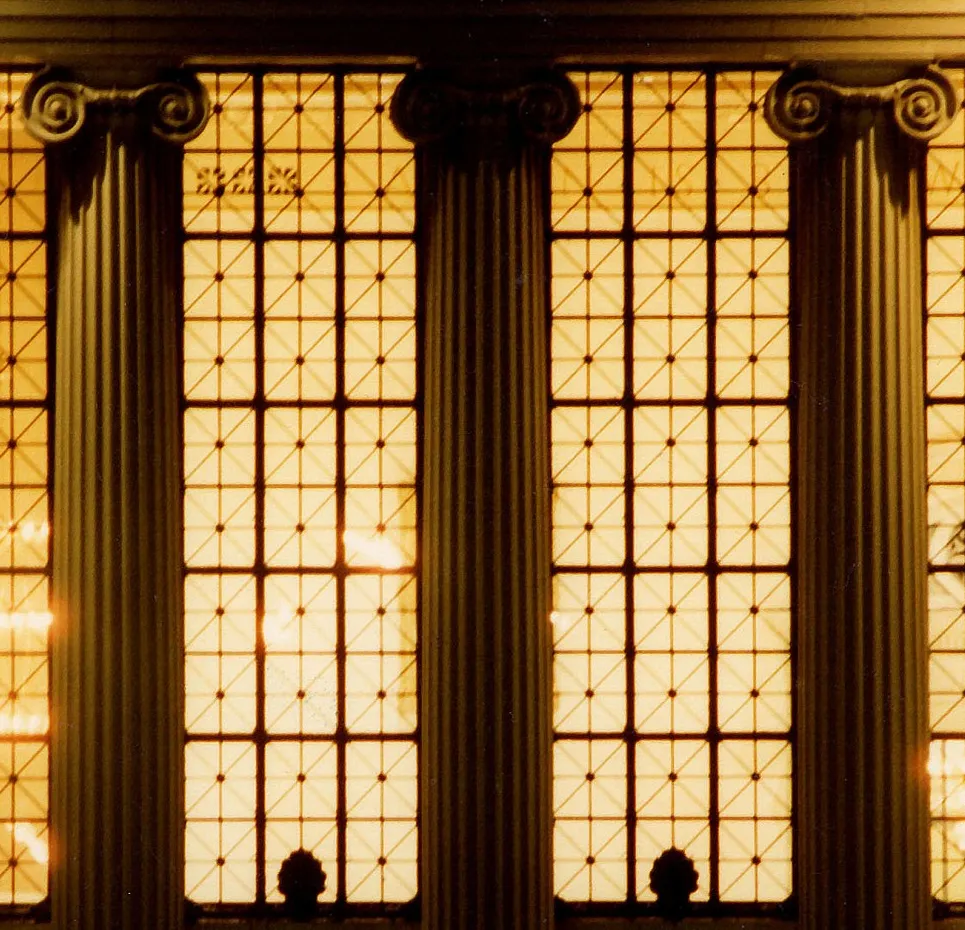 Image of Butler Library columns and windows, lit from within
